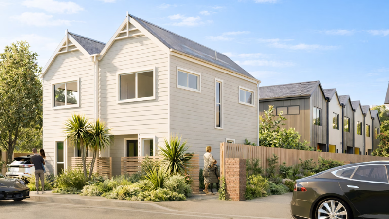 Exterior view of ISOLA townhouse development in Island Bay, showcasing modern architecture, landscaped gardens, and aluminium windows and doors.