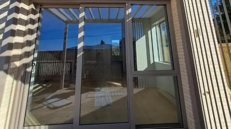 UNO Thermal glazed doors and windows opening to an outdoor area at 30 Milton Road.
