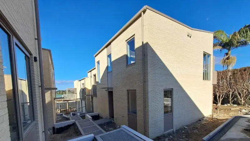 Multi-residential homes at 30 Milton Road during construction with aluminium windows and doors installed.