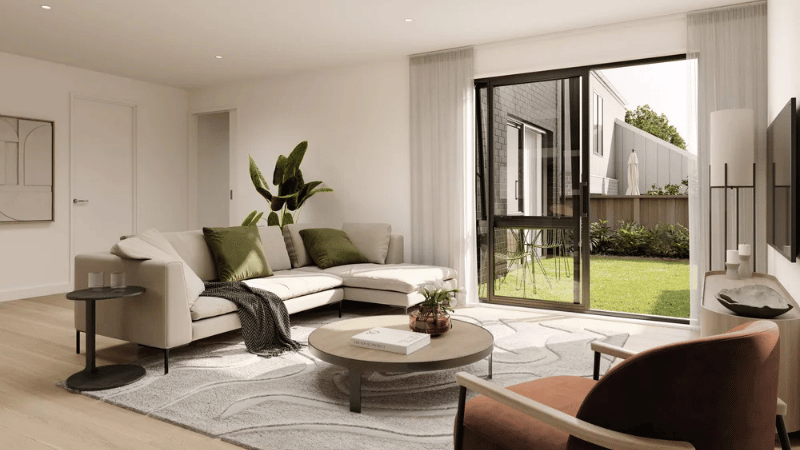 Living room render at Campbell Village with large aluminium sliding doors opening to a private outdoor area.