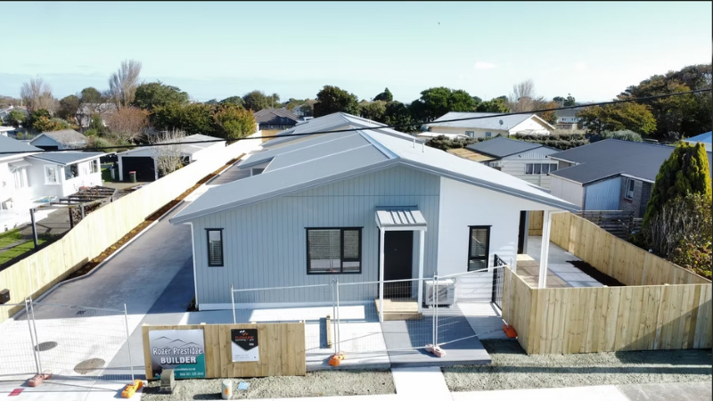 Single residential unit exterior with aluminium joinery and entry access in housing project