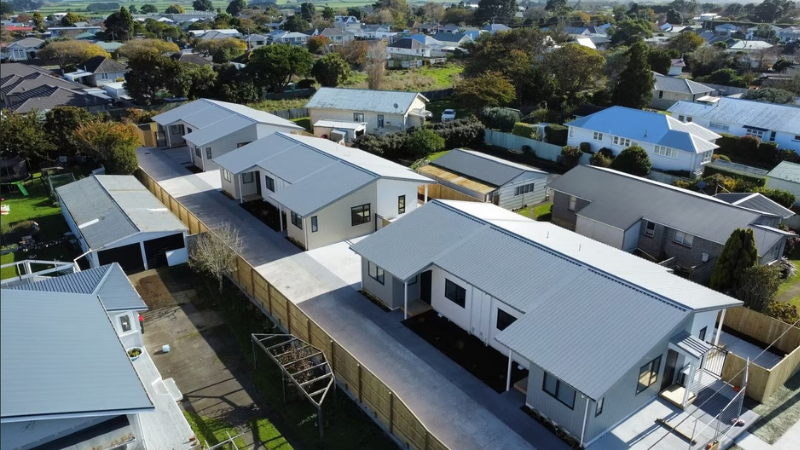 Aerial view of residential housing row with consistent aluminium windows and doors