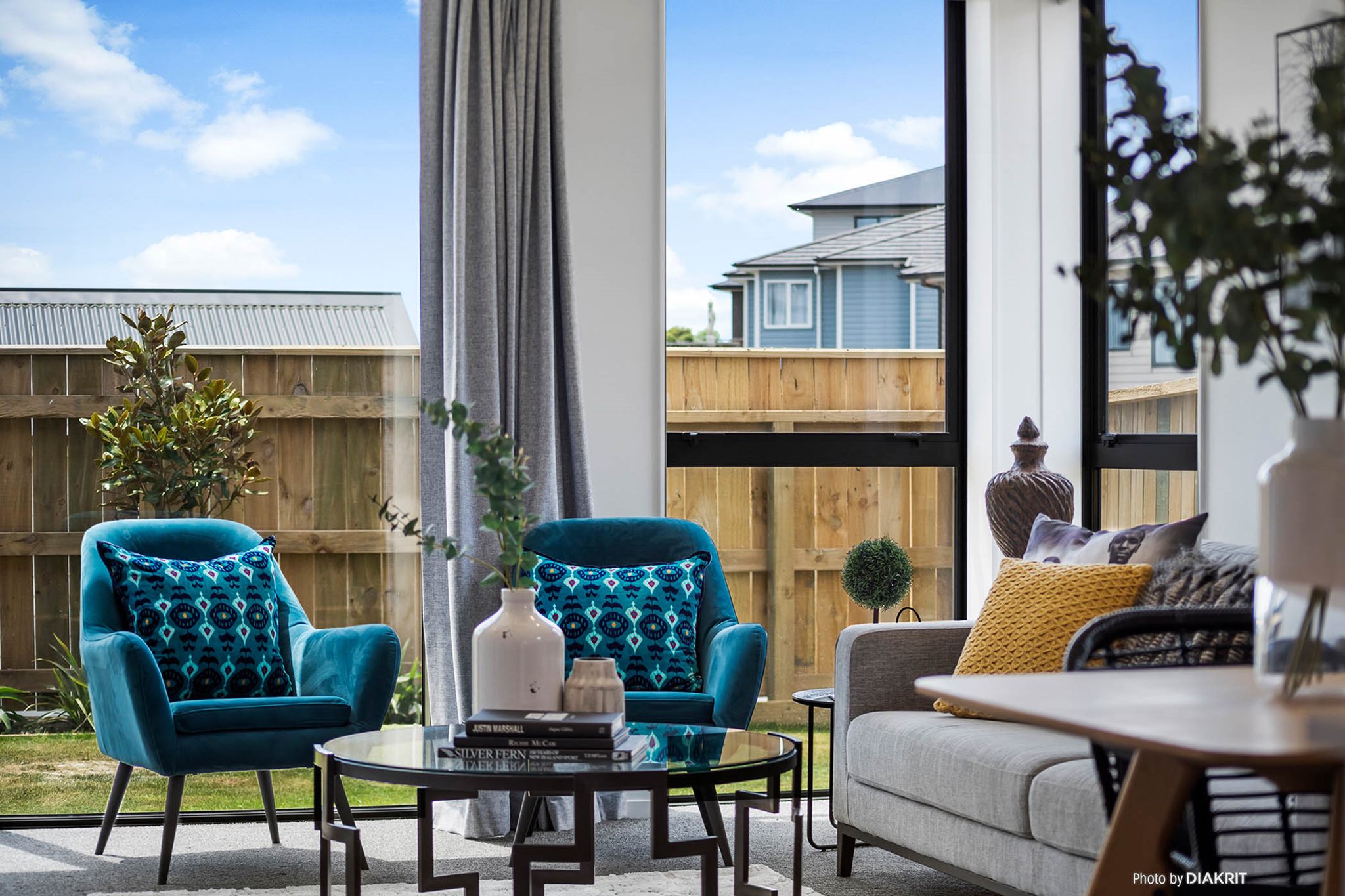 two blue chairs and a aluminium sliding door