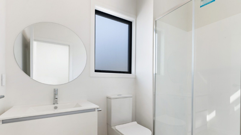 Contemporary bathroom featuring an aluminium awning window providing privacy, ventilation, and natural light.
