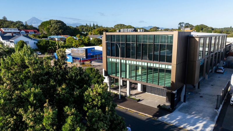 Aerial view of the Leach Street Development showing the multi-level commercial building and glazed façade.