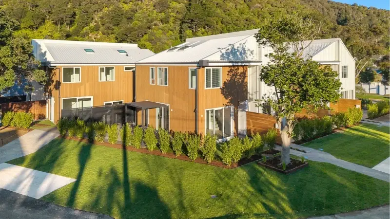 Elevated view of the Puriri Street development showing multiple homes fitted with UNO Thermal aluminium windows and doors.