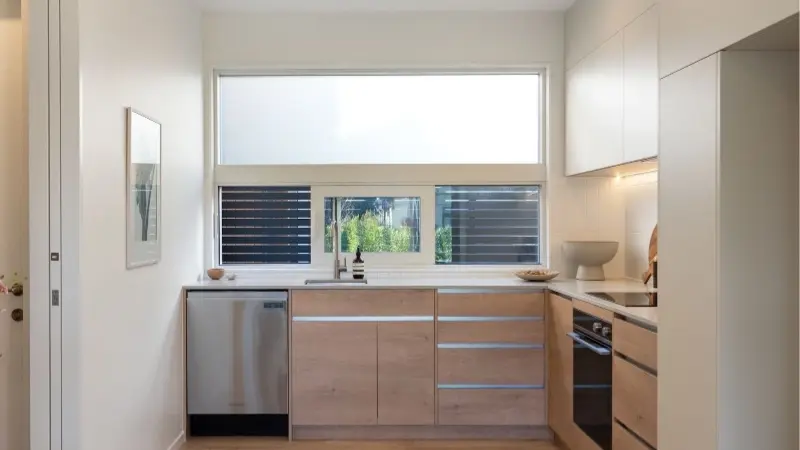 Contemporary kitchen featuring fixed aluminium windows with Clear Low-E glazing.