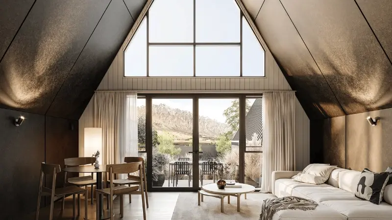 Modern chalet interior with large thermal aluminium windows and doors overlooking alpine landscape